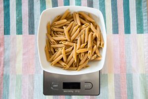 A Plate of Pennette Pasta On A Digital Scale