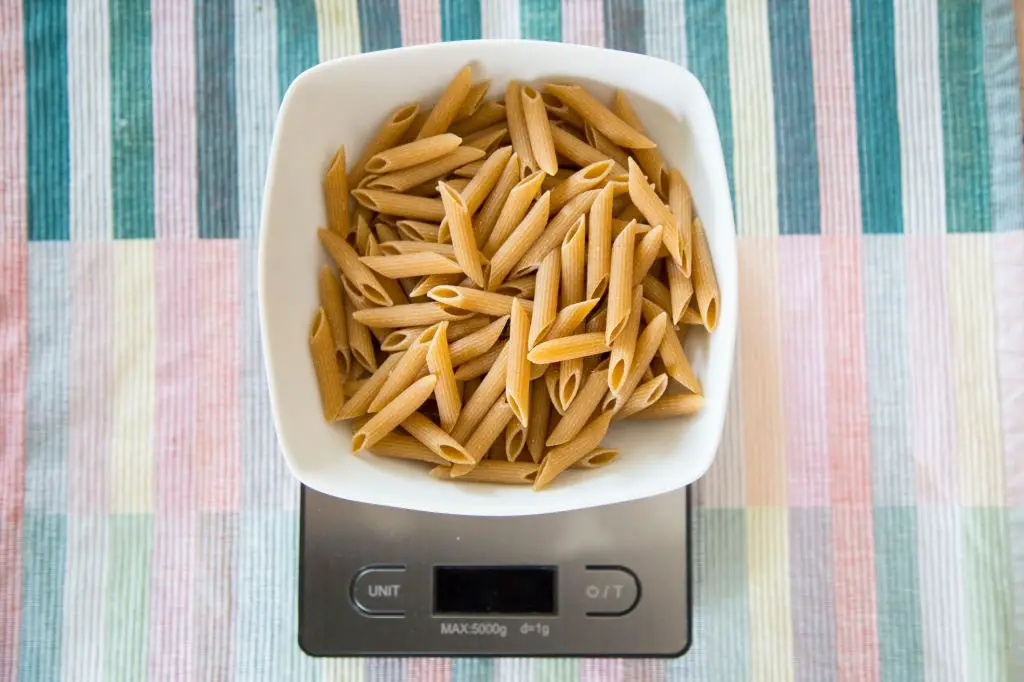 A Plate of Pennette Pasta On A Digital Scale