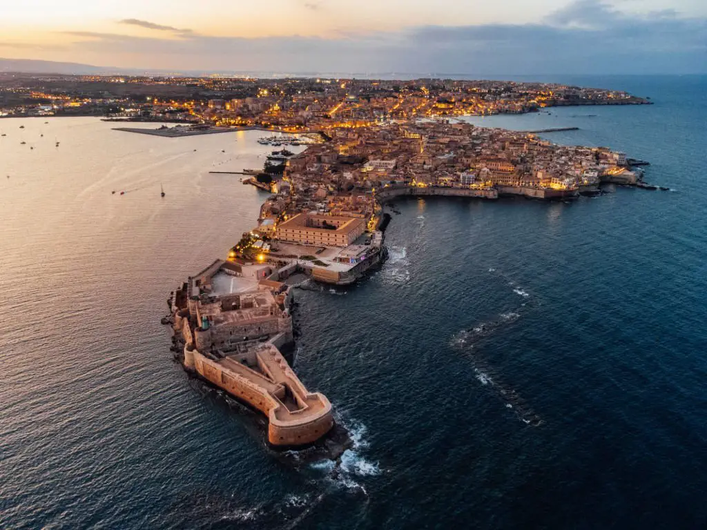 Aerial view of Ortigia Island and Siracusa city at sunset Landmark in Sicily Italy