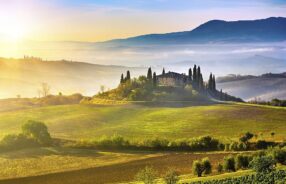 Tuscany foggy landscape at sunrise Italy