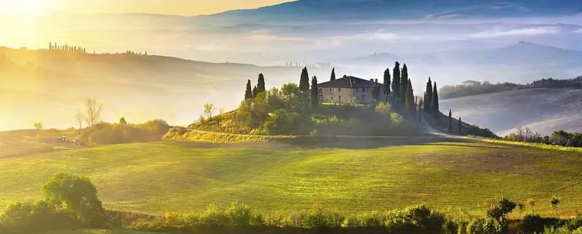 Tuscany foggy landscape at sunrise Italy